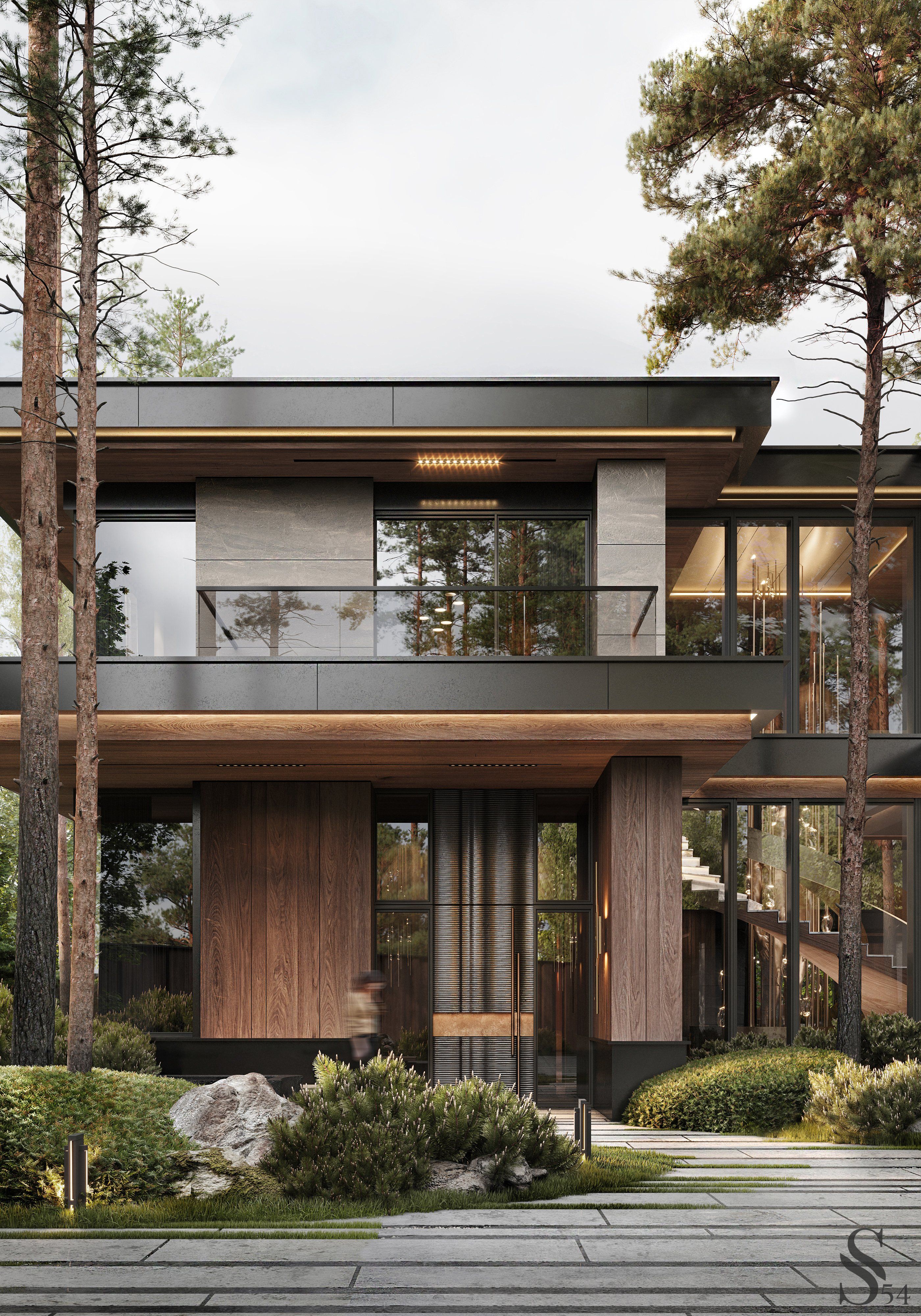 Фасад дома выполнен из термообработанного дерева, керамогранита и металла