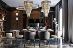 The exquisite dining area is adorned with statement Eichholtz chandeliers
