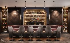 The bar. The island is decorated with genuine wine-coloured leather and black porcelain stoneware. The spirits niche and the side showcases are decorated with red Rosso Levanto Turco marble